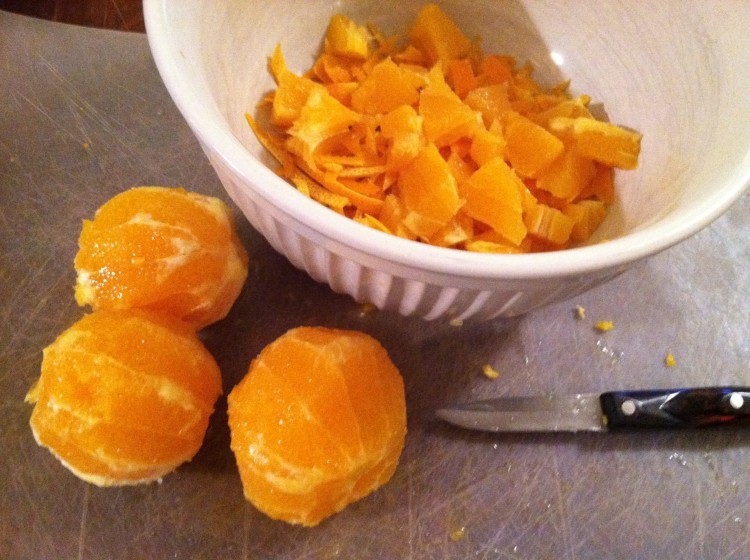 peeled oranges and bowl